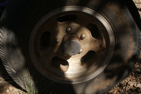 1978 Ford Bronco - A close-up view of a vehicle's wheel and tire, showing wear and dirt. The Supermotors.net logo is visible in the lower right corner.