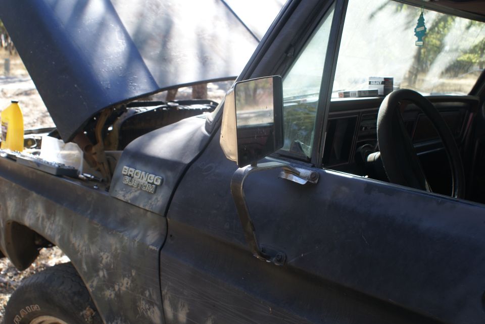 Black 1978 Ford Bronco, driver's side with hood open