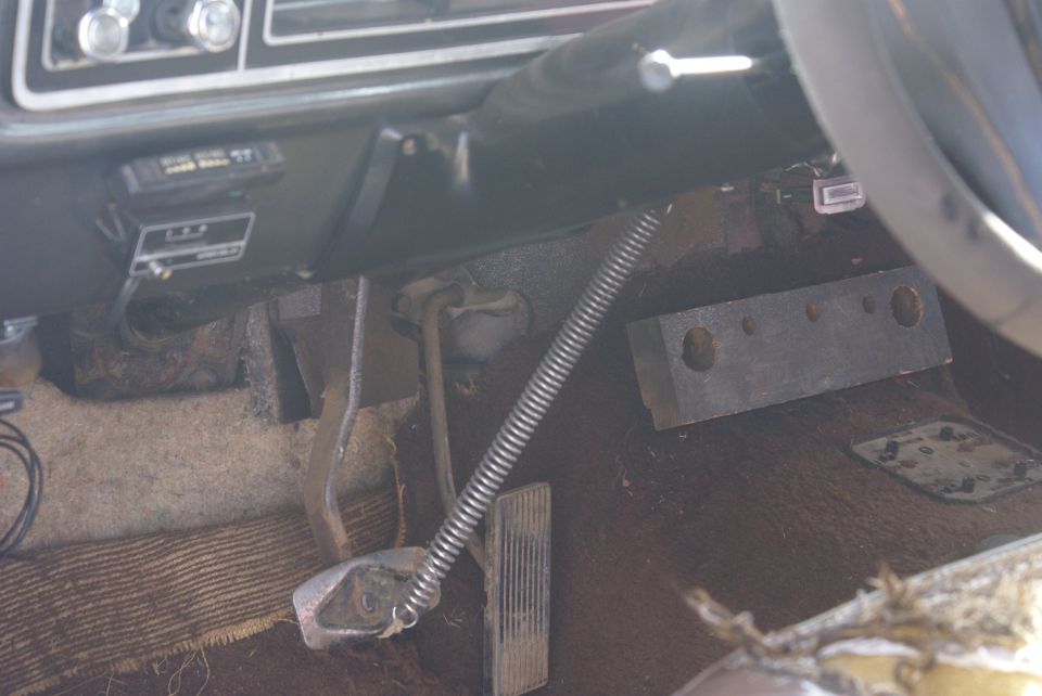 1978 Ford Bronco interior showing pedals, dashboard, and steering wheel