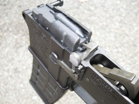 2000 Ford Crown Victoria - A detailed view of a firearm's receiver, showing its internal components and construction.