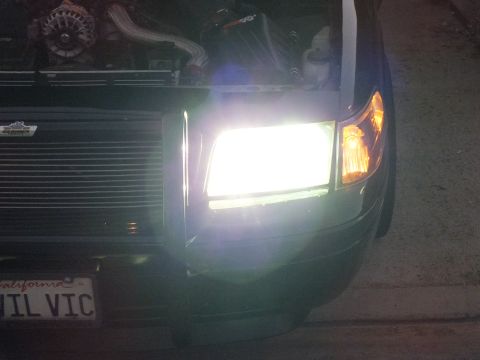 2003 Ford Crown Victoria - Bright HID corner of the Crown Victoria with amber turn marker, billet grille and EVIL VIC plate below