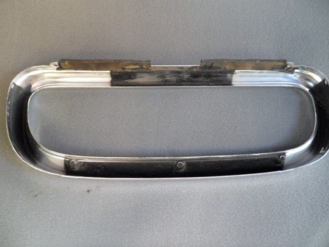 1994 Jeep Cherokee - A close-up view of a chrome trim piece with rubber inserts, likely a vehicle part.