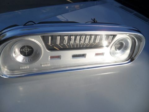 1994 Jeep Cherokee - Dashboard gauge cluster showing fuel level, speed, and indicator lights for wipers and lights.