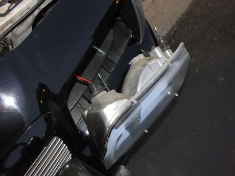 2003 Ford Crown Victoria - Pair of polished headlight units staged in the Crown Victoria's front corner with billet grille below