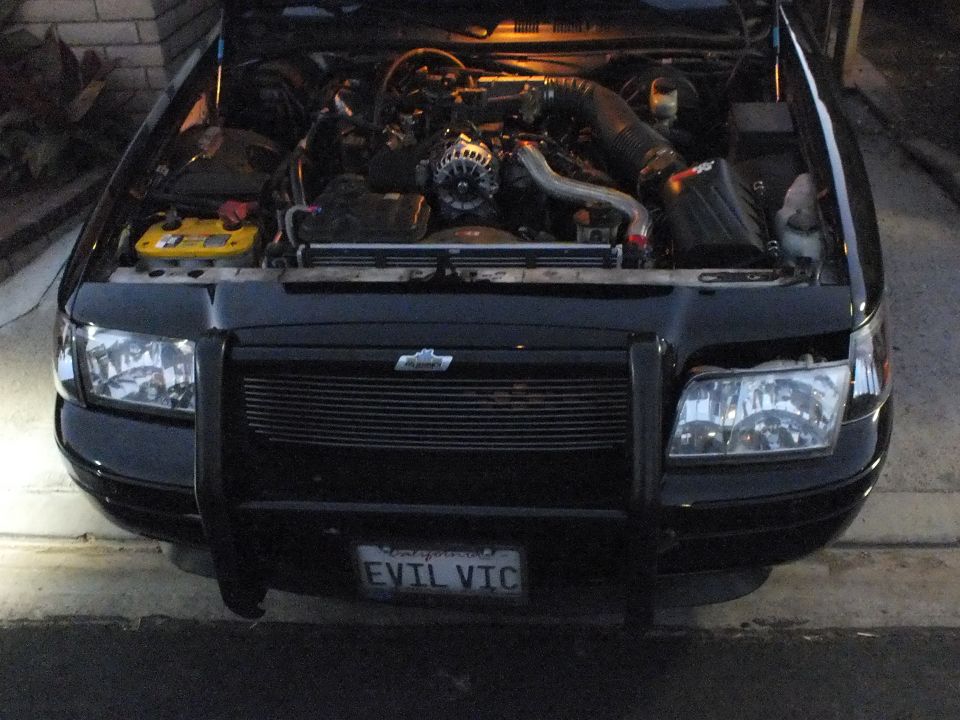 Front view of black sedan with brush guard, turbo engine bay and EVIL VIC plate