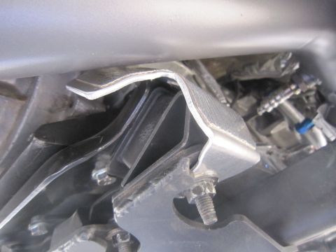 2008 Jeep Wrangler - Underside view of a vehicle's engine mount bracket and associated hardware.