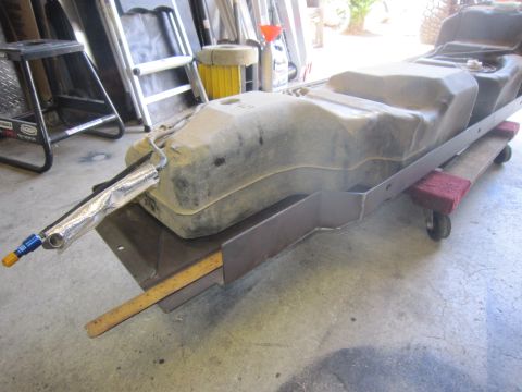 2008 Jeep Wrangler - Aftermarket fuel tank assembly with custom metal bracket and fittings.