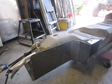 2008 Jeep Wrangler - A custom metal skid plate is shown, designed to protect a vehicle's fuel tank.