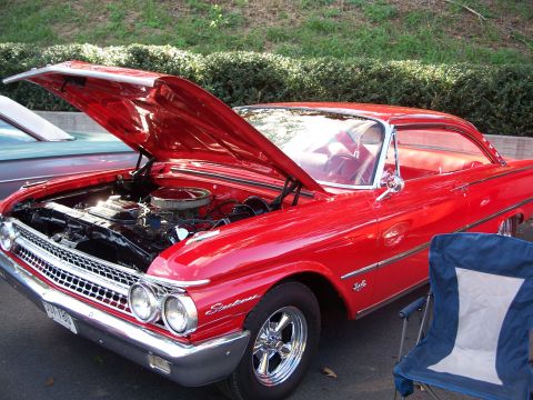 1971 Ford Ranchero - This red 1960 Ford Falcon Ranchero displays its engine with the hood open, a distinctive grille and body style.