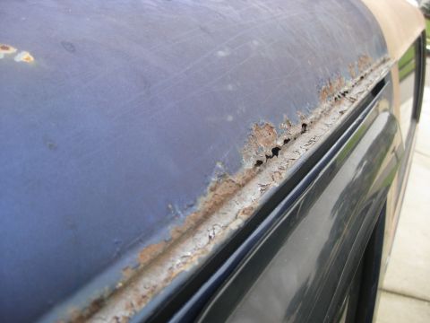 1994 Ford Bronco - Significant rust is visible along the upper edge of the vehicle's body panel.