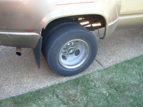1997 Chevrolet Silverado 3500 - You can't even tell I fixed anything! But before putting the wheels back on, I cleaned all their mounting surfaces with a cup brush to remo…