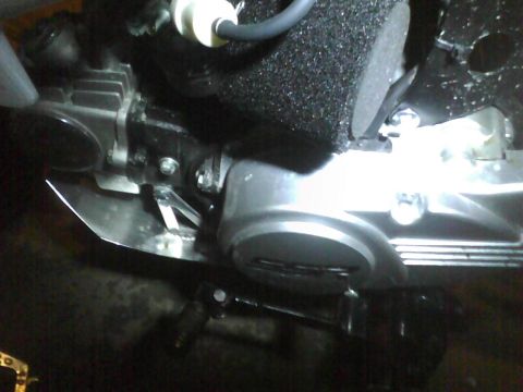 2003 Ford Crown Victoria - Close-up of an engine component with visible metal and foam elements.