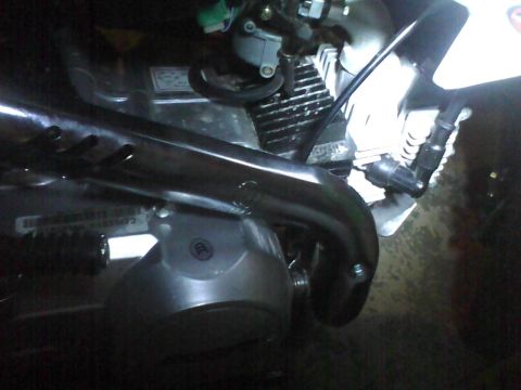 2003 Ford Crown Victoria - Detail of a motorcycle engine, focusing on the exhaust and cooling fins.