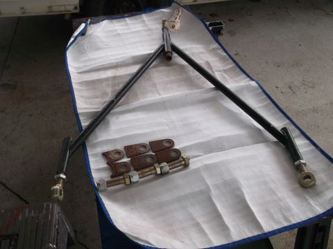 1971 Ford Ranchero - A black suspension component with associated hardware is laid out on a white protective sheet.