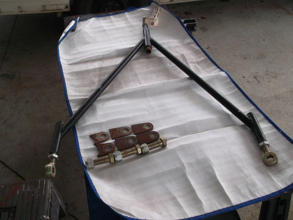 Black suspension part with bolts and brackets