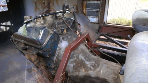 1978 Ford Bronco - The engine bay and interior of a vehicle appear to be in a state of disrepair.