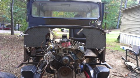 1978 Ford Bronco - This custom vehicle has its engine compartment open, showing the engine and surrounding chassis components.