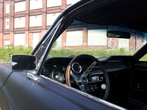 1968 Ford Mustang - Interior view of a 1968 Ford Mustang, its classic dashboard and steering wheel.