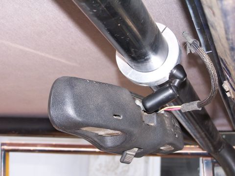 1973 Ford Bronco - Interior view of a vehicle's rear-view mirror assembly mounted on a roll cage.