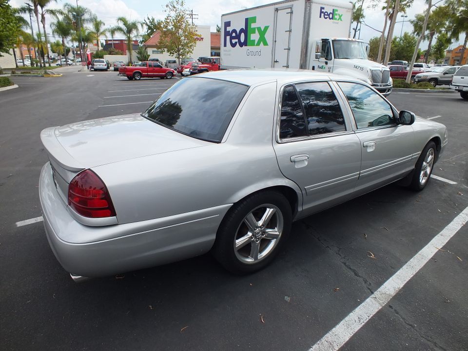 Silver Mercury Marauder sedan rear three-quarter view in a parking lot