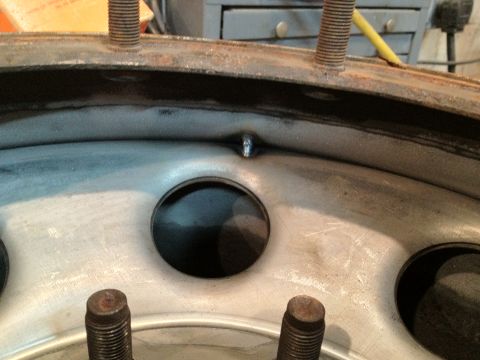 1989 Ford Bronco - Close-up of a metal wheel rim, showing a weld and lug studs, with a Supermotors.net watermark.
