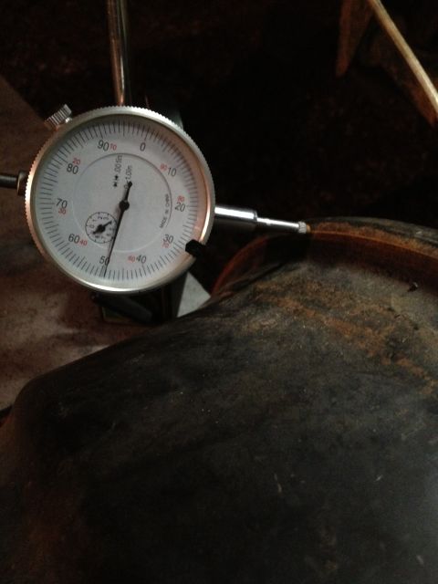 1989 Ford Bronco - Dial indicator used for precise measurement of a component. Text on dial indicates measurement in thousandths of an inch.