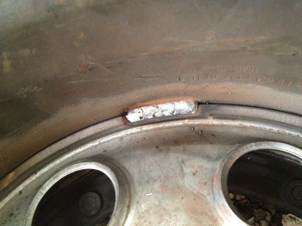 Welded wheel rim with visible weld bead and bolt holes