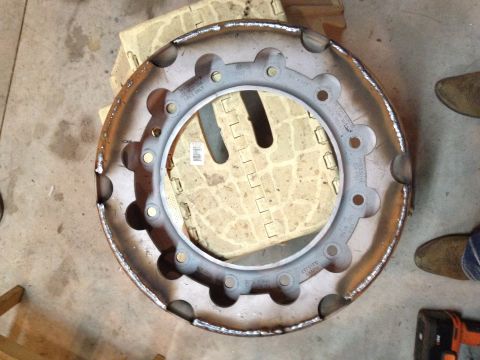 1989 Ford Bronco - A single metal wheel rim is shown, with text visible on its surface.