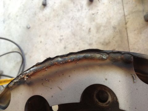 1989 Ford Bronco - Close-up of a metal part showing welding and cutouts, with Supermotors.net watermark.