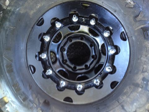 1989 Ford Bronco - A detailed view of a heavy-duty wheel and tire assembly, likely for an off-road vehicle.