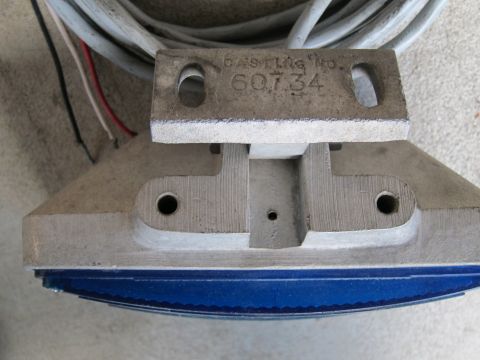 1991 Ford LTD Crown Victoria - Close-up of a metal part labeled 'CASTING NO. 60734' with attached wires and blue trim.