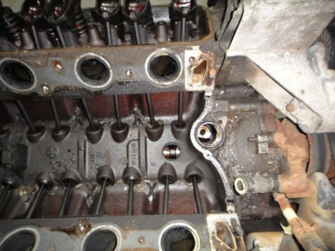 1994 Ford Bronco - Close-up view of engine cylinder head components, including pushrods and valve stems.