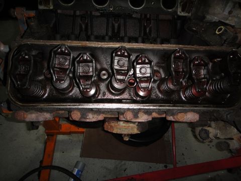 1994 Ford Bronco - The internal components of an engine's valve train are shown, coated in dark oil.