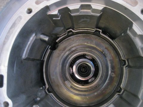 1994 Ford Bronco - In this picture the anit-clunk spring can be seen in the upper right between the case and planetary gearset. It is installed with the tabs…