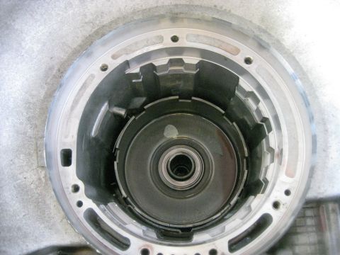 1994 Ford Bronco - The forward clutch hub is set into place. There are a few gears and splines that need to line up before it seats fully.
