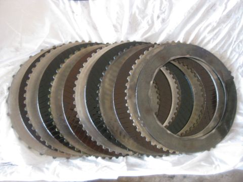 1994 Ford Bronco - Forward clutch disks removed. Note that some are burnt more than others. Also not the extra steel on the far right. That will be covered mo…
