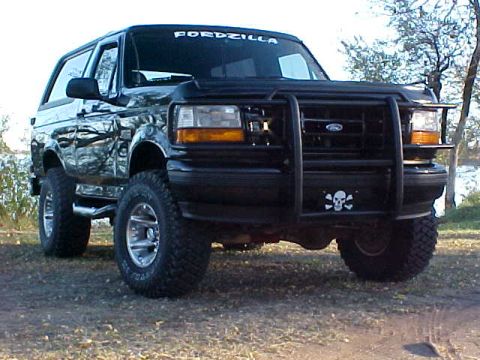 1995 Ford Bronco - This 1995 Ford Bronco features a prominent bull bar and a skull decal on the front bumper.
