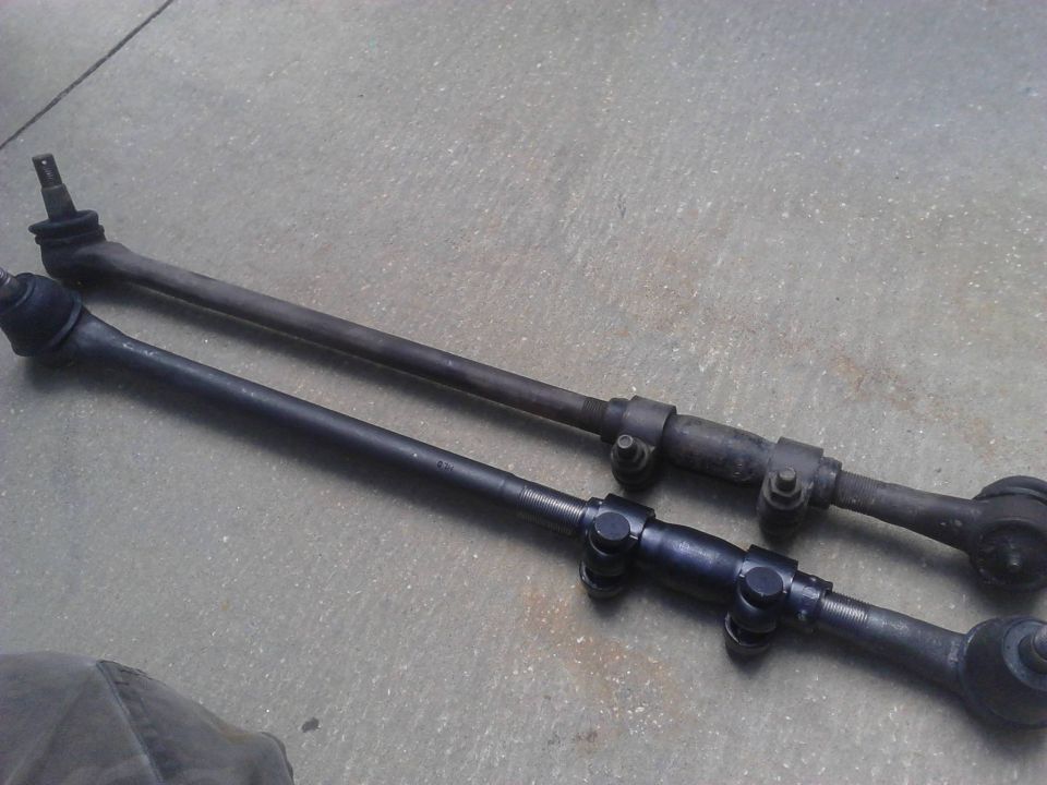 Comparision of the short (driver side) Inner Tie Rods with Tie rod ends attached. The new ones were perfect length, left alot of adjsutment in the sleeves for in and out. Try and keep both sides of the sleeves with an equal amount of threads. The picture doesnt really show but the new rods are defenitly stronger looking.