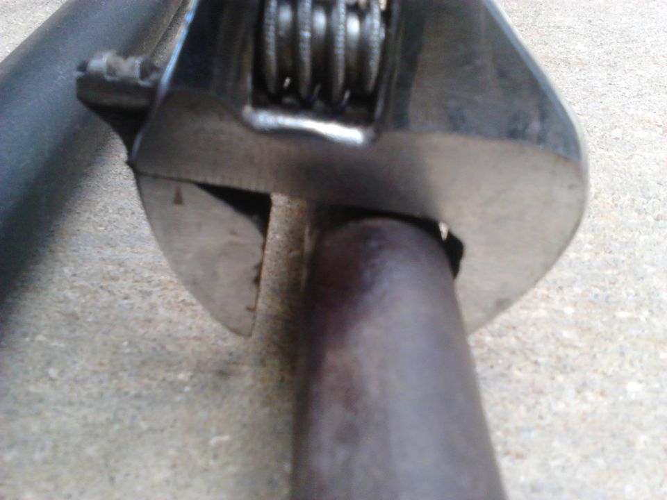 Comparison of thickness of the driver side Inner Tie Rods. The wrench shows the thickness of the new rod over the old. The new rod has a thinkness of about 7/8 of an inch compared to the stock wehich was about 3/4 of an inch. It doesnt sound like much more but it should help alot in strength.