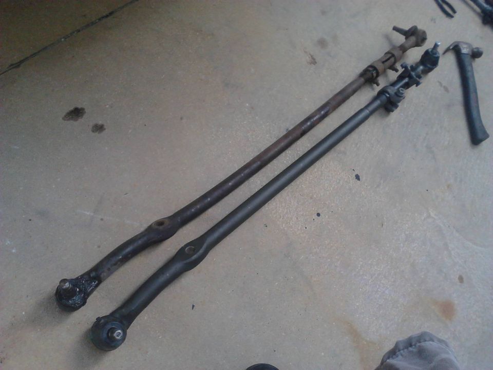 Comparision of the long (passenger side) Inner Tie Rods with Tie Rod Ends attached. The new ones were perfect length also, left alot of adjsutment in the sleeves for in and out. Try and keep both sides of the sleeves with an equal amount of threads. The picture somewhat shows that the new rods are defenitly stronger looking. Might also be able to see that the stock rod was slightly bent in some areas