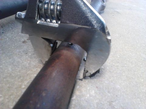 1996 Ford Bronco - Comparison of thickness of the passenger side Inner Tie Rods. The wrench shows the thickness of the new rod over the old. The new rod has a…
