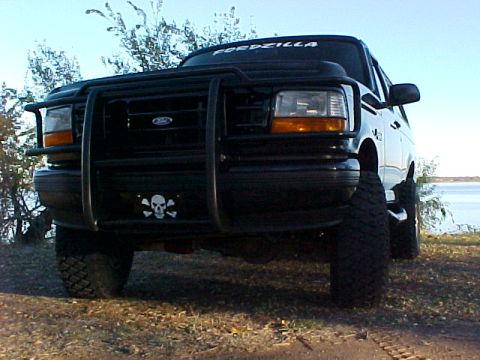 1995 Ford Bronco - 1995 Ford Bronco parked outdoors with a bull bar and "FORDZILLA" decal on the windshield.