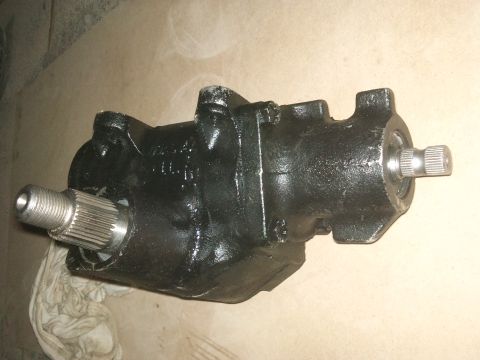 1998 Ford Crown Victoria - A close-up view of a vehicle's steering gear box, a crucial component for directing the wheels.
