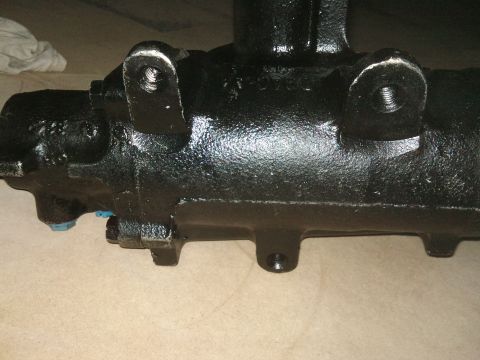 1998 Ford Crown Victoria - Close-up of a black painted steering gear housing, likely a replacement part.