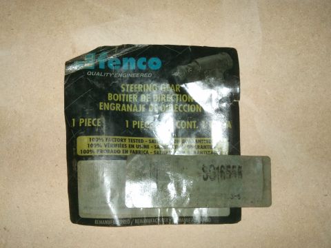 1998 Ford Crown Victoria - A steering gear part is shown in its original packaging, which includes multilingual text and a product code.