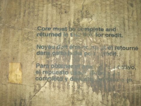 1998 Ford Crown Victoria - Instructions for returning a part for credit are printed in multiple languages on this cardboard box.