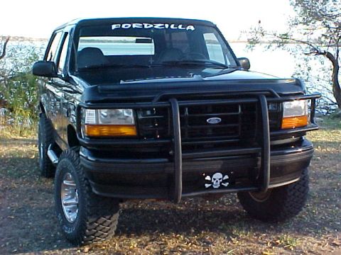 1995 Ford Bronco - This black 1992 Ford Bronco is equipped with a heavy-duty bull bar and a skull and crossbones license plate frame.