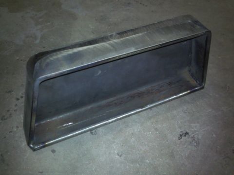 1993 Ford F-150 - A custom-fabricated metal intake pipe is shown resting on a concrete surface.