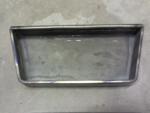 Metal tray with welded seams, viewed from above