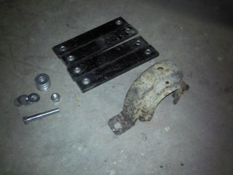 1993 Ford F-150 - Various automotive parts and hardware are arranged on a concrete surface, likely for installation or inventory.